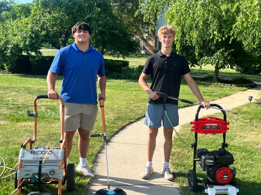 Premier Home Services team with pressure washing equipment